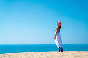 young woman look to the horizon on the awsome beach