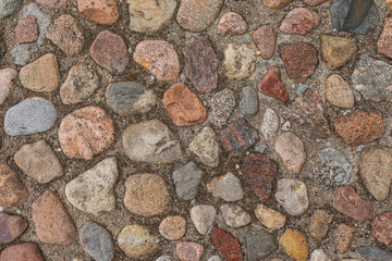 Pavement in colorful cobblestones, pattern seamless, texture