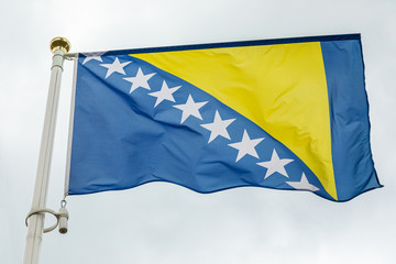 flag of Bosnia and Herzegowina with yellow triangular and white stars