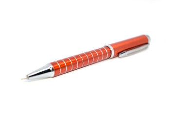 Photo of an automatic red pencil on a light background.