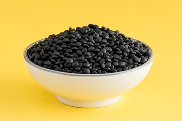 Uncooked Black Lentils in a Bowl