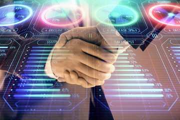 Multi exposure of business graph on abstract background with two men handshake. Concept of success