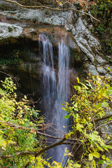 Beautiful mountain waterfall in a picturesque environmentally clean place. Recreation concept in remote locations