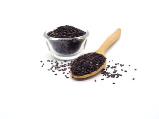  Black sesame in bowl and spoon isolated on white background.