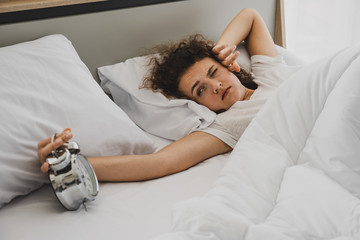 a woman on the bed at morning