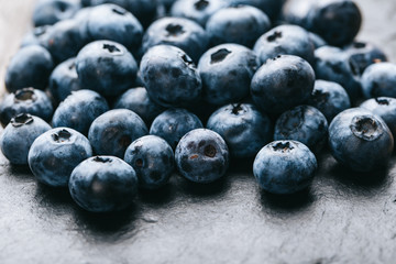 Fresh blueberry background. Texture blueberry berries close up. Vegan and vegetarian concept.
