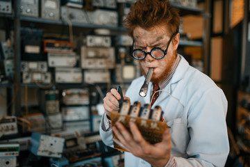 Strange engineer soldering chips, test in lab