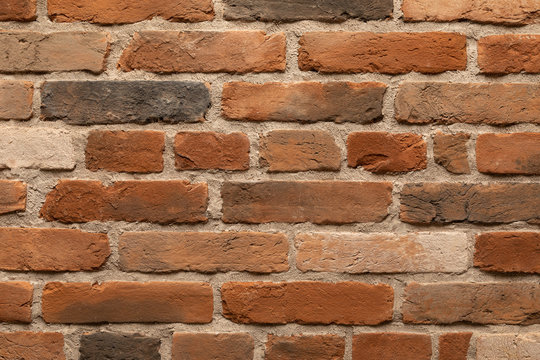 Elevated view of brown and red flame brick wall