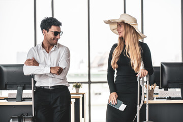 Employee in office ready to travel on summer vacation and celebrating the summer holidays. Attending summer festivals, celebrating the summer Concept.