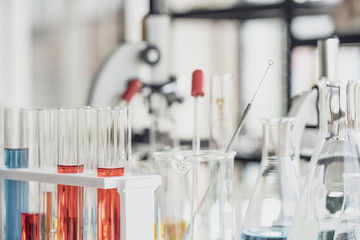 Team of Medical Research Scientist Conducts Experiments in Laboratory with Microscope, Test Tubes, Micropipette and other equipment.