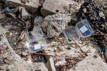 Plastic containers and trash in the forest. Environmental pollution. Environmental issue and disaster. Go Green, Zero Waste, Save the Planet, Earth Day, No Plastic, Recycling Concept