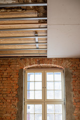 Fototapeta premium in laborious work an old house is restored