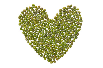 Closeup symbol of heart made of green mung beans isolated at white background.