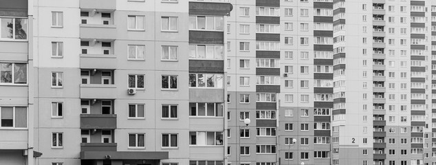 gray sad black and white view to city apartments with balconies