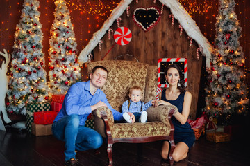 happy family of three in a chair for Christmas