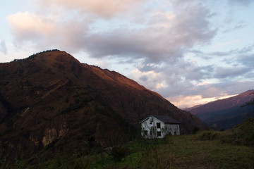 A house in the mountains during sunset