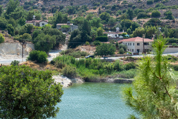 Fototapeta na wymiar Pond among the village