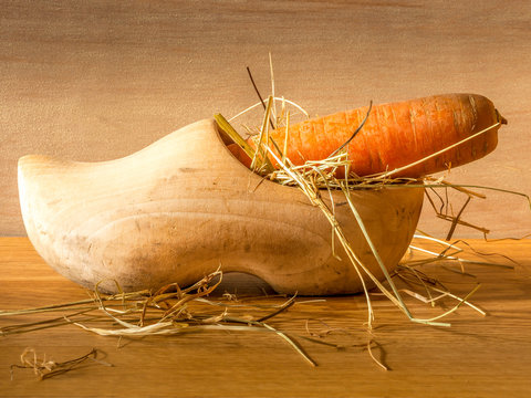 Wooden shoe filled with hay and a large carrot for the Dutch fest of Sinterklaas