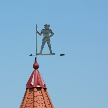 Weathervane in the form of a knight on the roof.