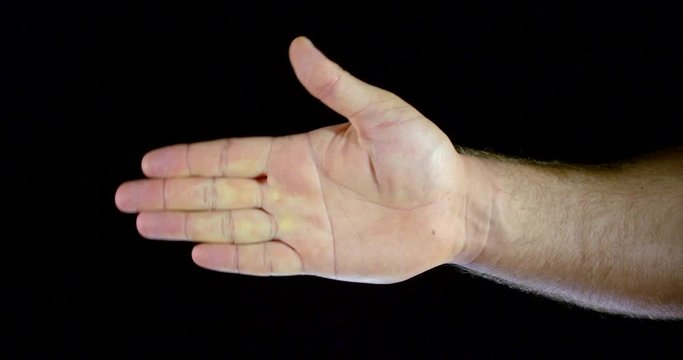 men large hand movements of the hand grip of the fist and the beating on a black isolated background