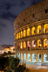 Fototapeta na wymiar Roman colosseum landmark in night light. Italy