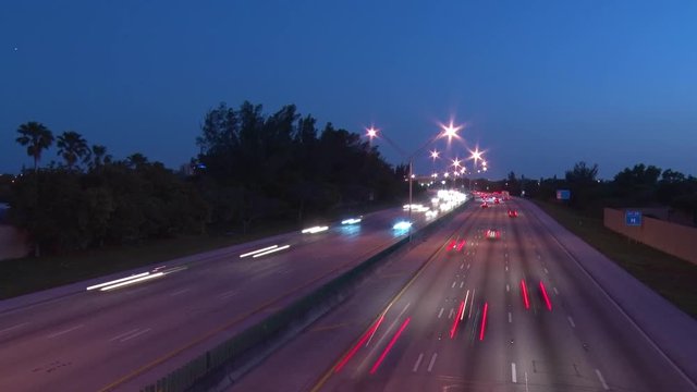 Interstate 95 at 48th Street in Deerfield Beach, Florida After Dusk in Twilight with Cars Creating Short Streaks in a Slow Shutter-Speed Time-Lapse