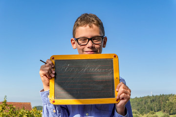 smart boy with glasses and blackboard on 