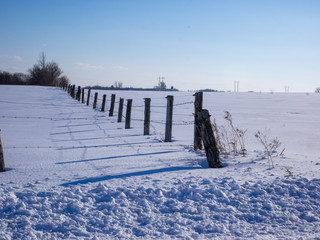 A wooden fence in the field.