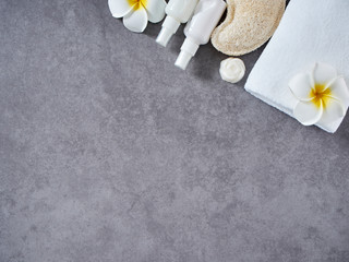 Set of spa accessories on gray marble background.