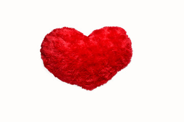 Obraz na płótnie Canvas small red heart fur pillow on white background isolated