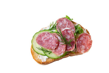Sandwich with sausage, lettuce and cucumber isolated on a white background.