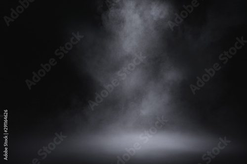 empty floor with smoke on dark background