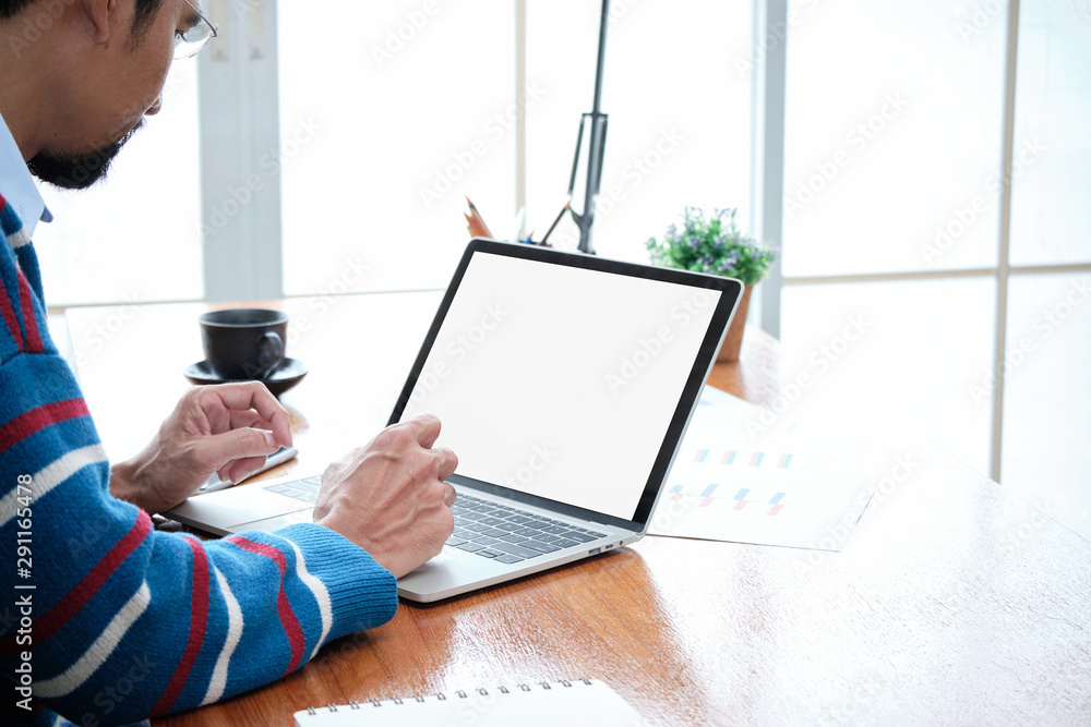 Poster close-up business entrepreneur's hand typing a keyboard on the laptop with an empty white screen for
