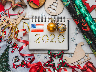 Fototapeta premium Merry Christmas and Happy New Year. Beautiful card with Christmas decorations. View from above, close-up, flat lay. Congratulations to loved ones, family, relatives, friends and colleagues