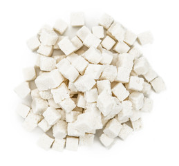 Portion of Coconut dices isolated on white background (selective focus)