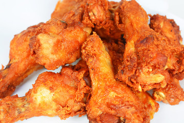 Fried chicken is placed on a white background. /Selective focus.