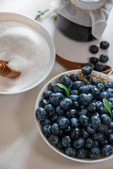 Huckleberry Jam close-up. Blueberry and sugar in a bowl in the kitchen
