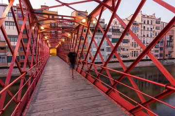 The Eiffel Bridge on the Onyar River at dusk in Girona, Catalonia (Spain)