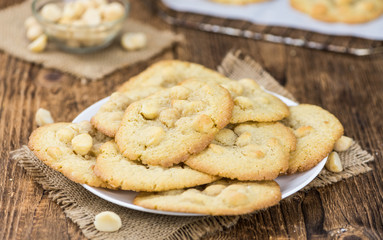 Some fresh Cookies on wooden background (selective focus; close-up shot)