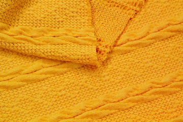The fabric is a waffle knit yellow. The texture of the knitted fabric