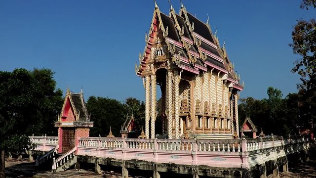 The Buddhist temple Nong Kae in Thailand. Traditional architecture - narrow monastery building, Thai countryside.