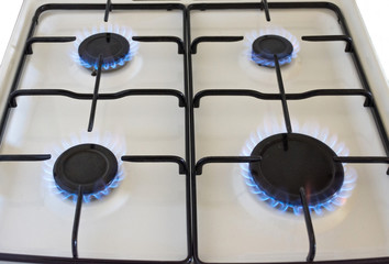 Energy efficiency concept with gas cooker – the cost of natural gas is more expensive. Close up, selective focus.