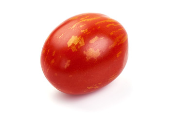 Fresh colorful sweet rustic tomato, isolated on white background
