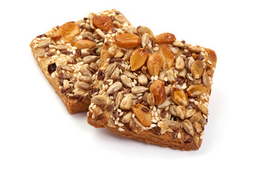Cookies with nuts and seeds of peanut, sunflower seeds, sesame, linen, bio organic food, isolated on white background