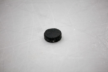 old hockey puck on ice