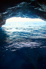 Blue Cave, Montenegro. The bright light of the entrance to the cave with water look blue. Sea grotto