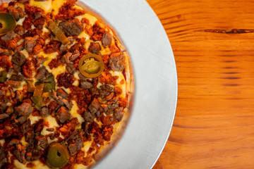 Pizza with meat and chili