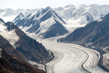 The Kaskawulsh Glacier flows from snowy mountains in Kluane National Park, Yukon, Canada