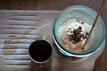 Affogato coffee with ice cream on a wooden table.