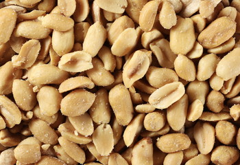 Salted peanuts dry roasted background and texture